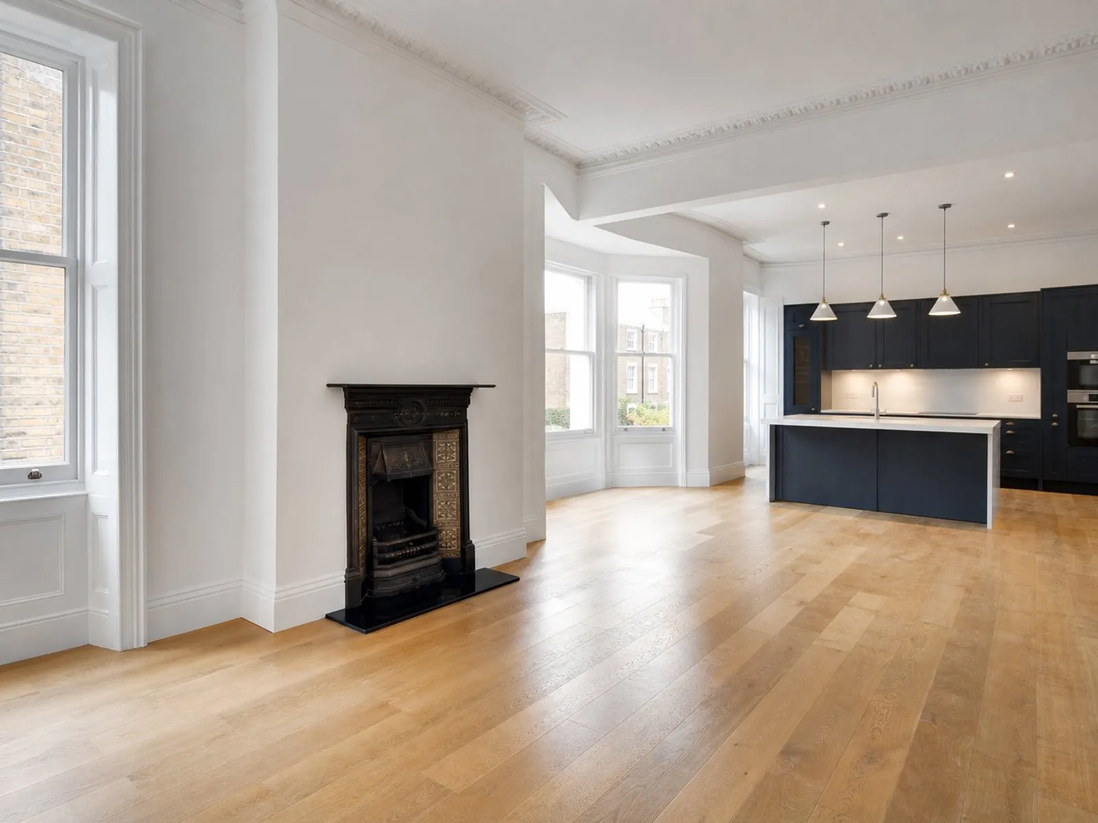 Fully refurbished open-plan flat interior with new flooring and decoration